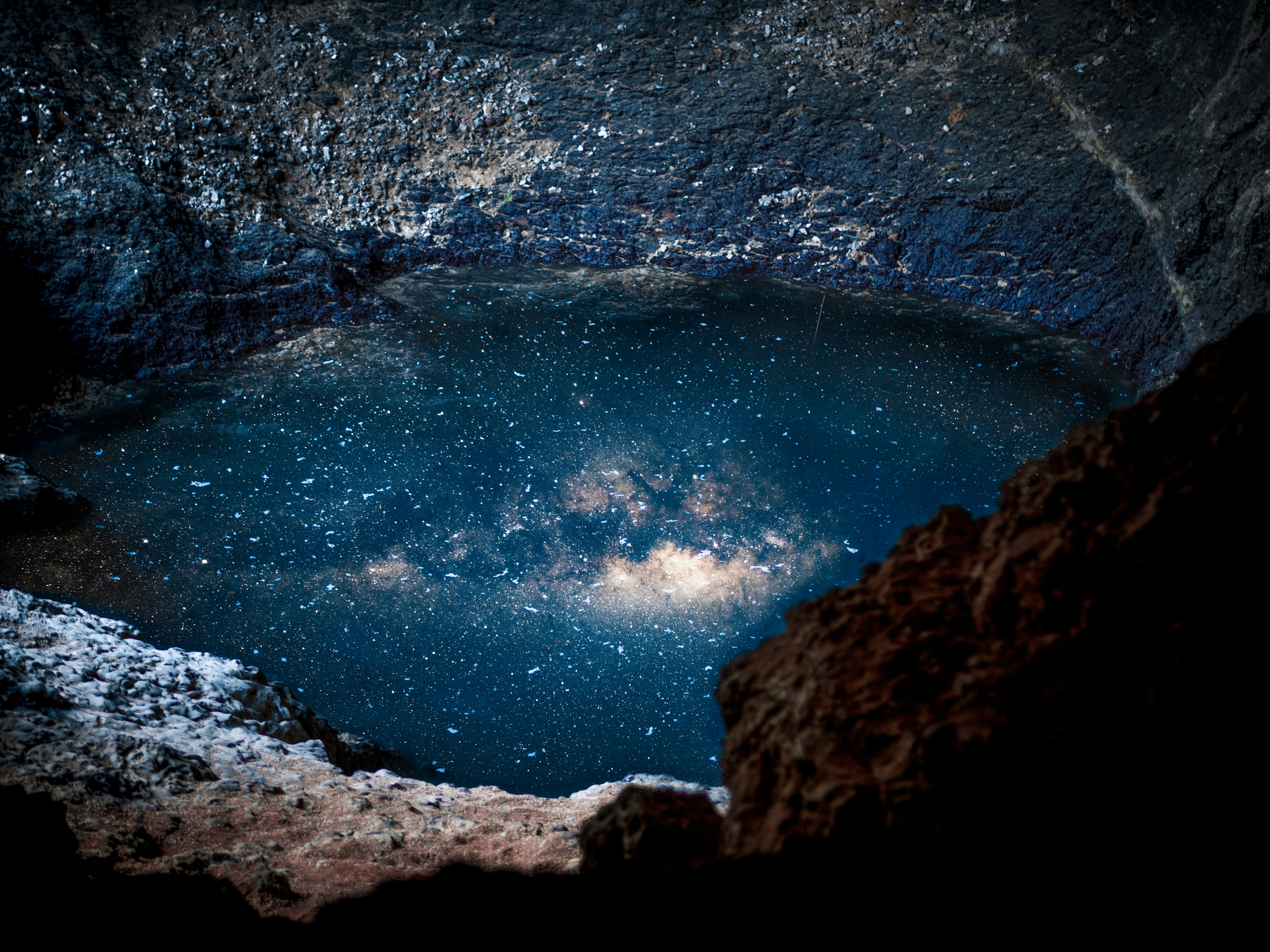 body of water reflecting night sky